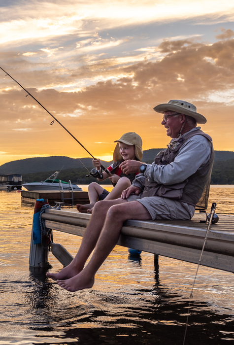 grandad and kid fishing